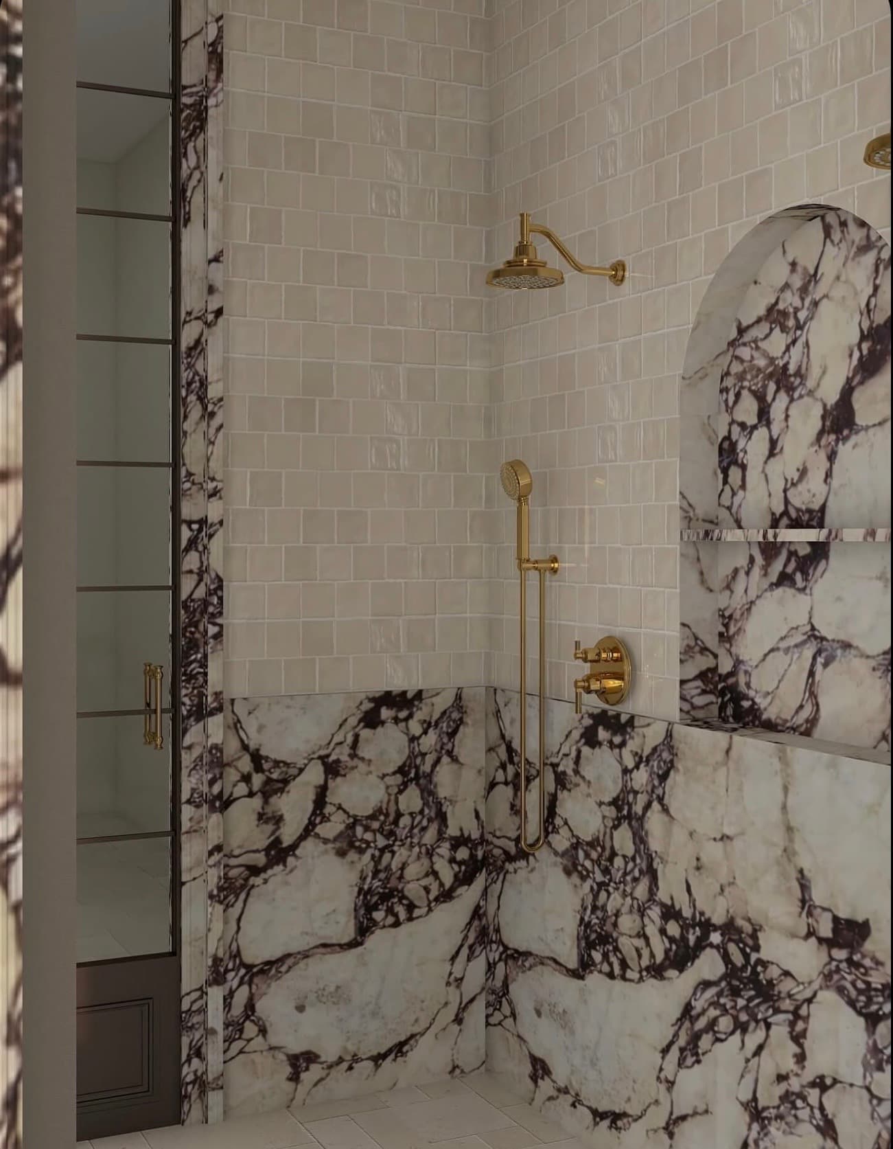 Ivory tile and richly veined stone with brass fixtures